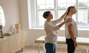 Chiropractor adjusting someone with scoliosis