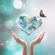 A crystal heart with a translucent image of Earth in it floating in a blurry background