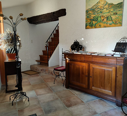 Solid wood entrance cabinet with the estate's Guestbook and tourist brochures for nearby activities