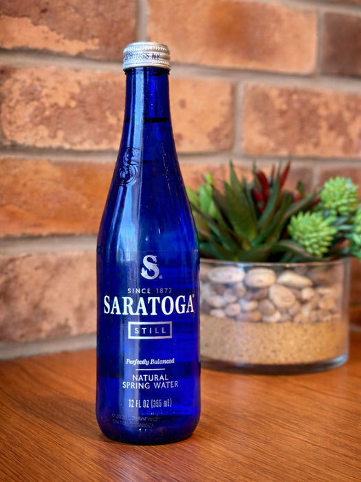 Blue bottle of Saratoga sparkling natural spring water