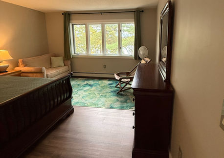 Bedroom with king bed in Fireside Retreat vacation rental in Bridgton Maine