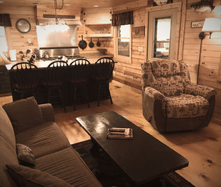 Table/Island, chair, coffee table in the cozy vacation rental on Moose Pond Denmark Maine