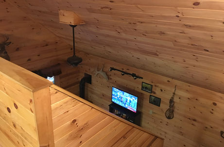 Pine walled stairway in the Denmark Maine vacation rental