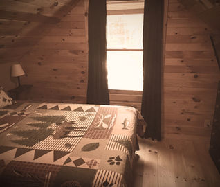 Bedroom in a Moose Pond vacation by REW Lake Rentals