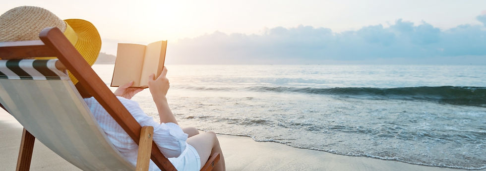 woman reading at the beach