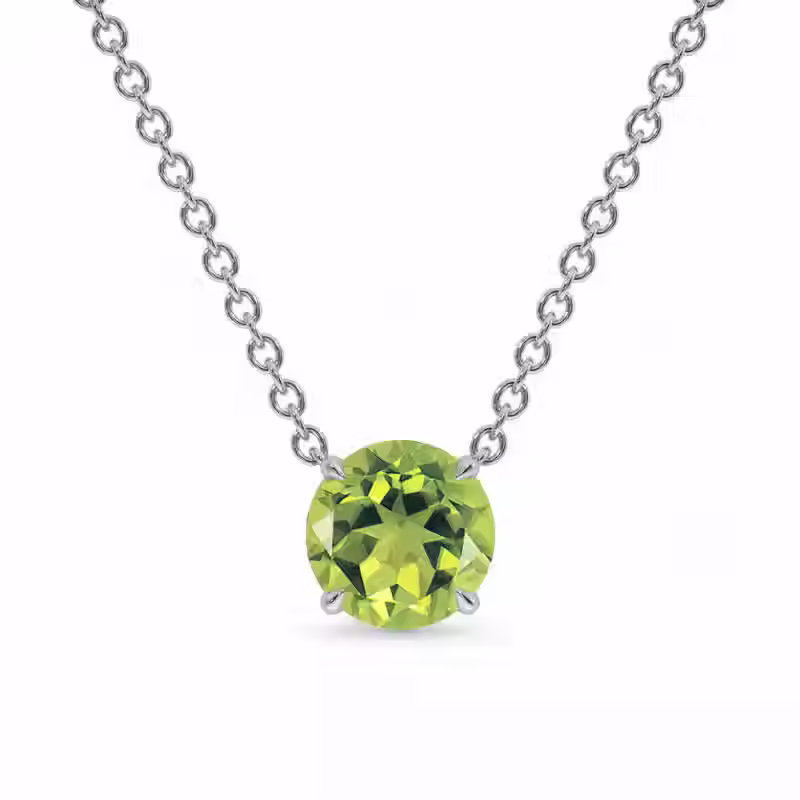Colar de corrente fina prateada com um grande pingente solitário de 10mm. A pedra redonda possui um tom verde limão vibrante