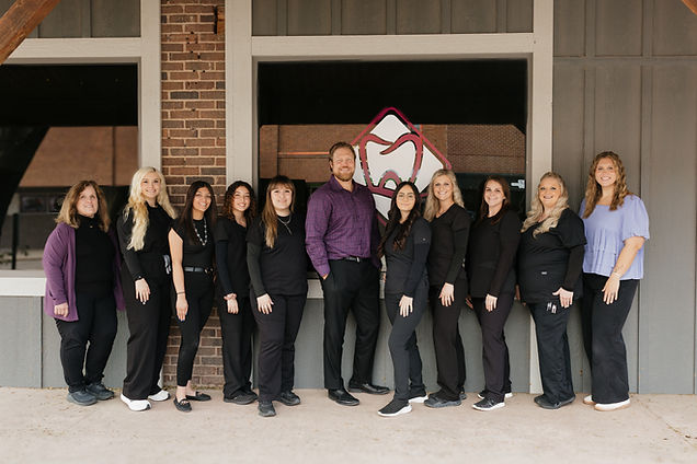 Staff photo outside office.jpg