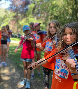 kids playing fiddle at a summer camp