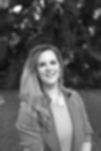 A black and white photo of a woman smiling at the camera - Alison Jones, a Digial Marketing Consultant in Canberra