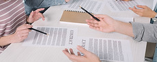 team-reviewing-contracts-at-a-corporate-table-2026-01-06-00-39-29-utc.jpg