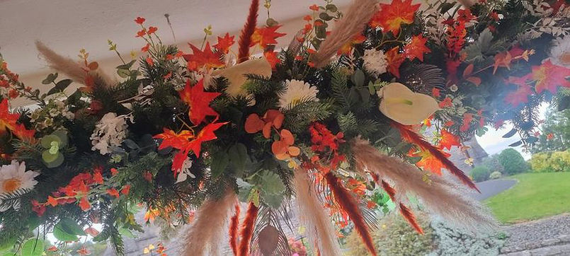 flower garland in the window.JPG