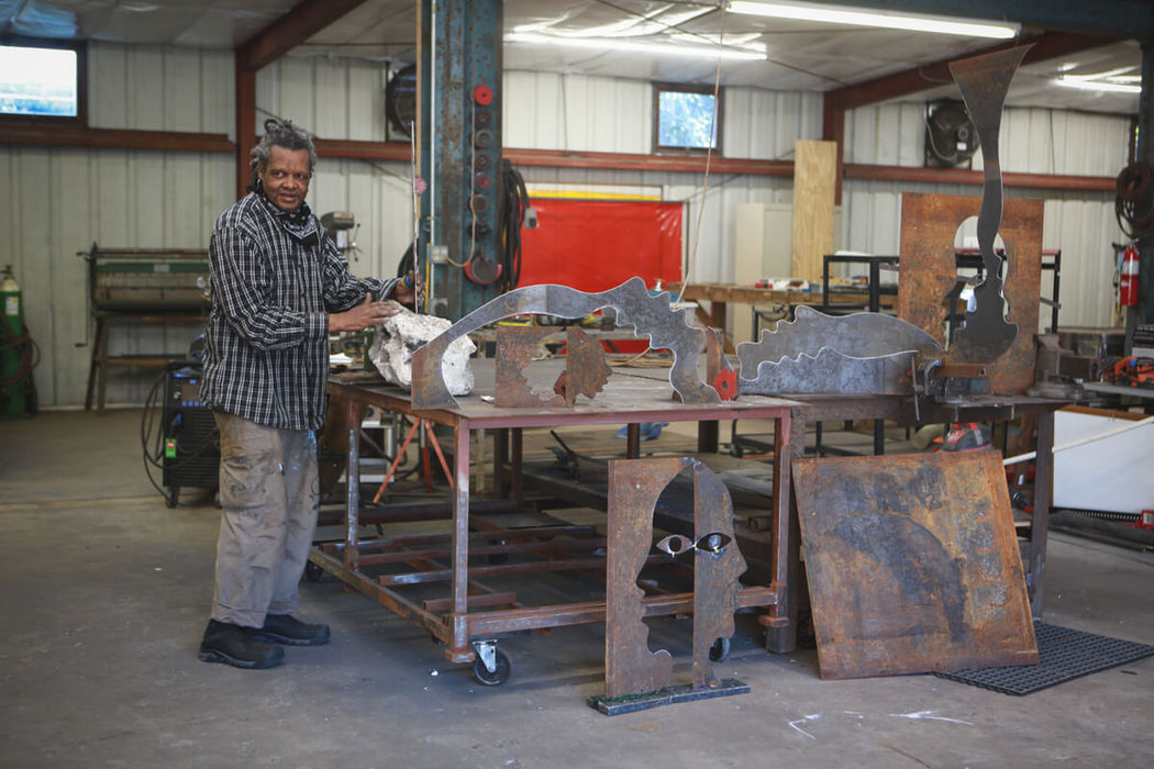 lonnie holley working on steel sculptures in the shop