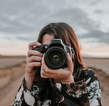 Woman Holding Camera