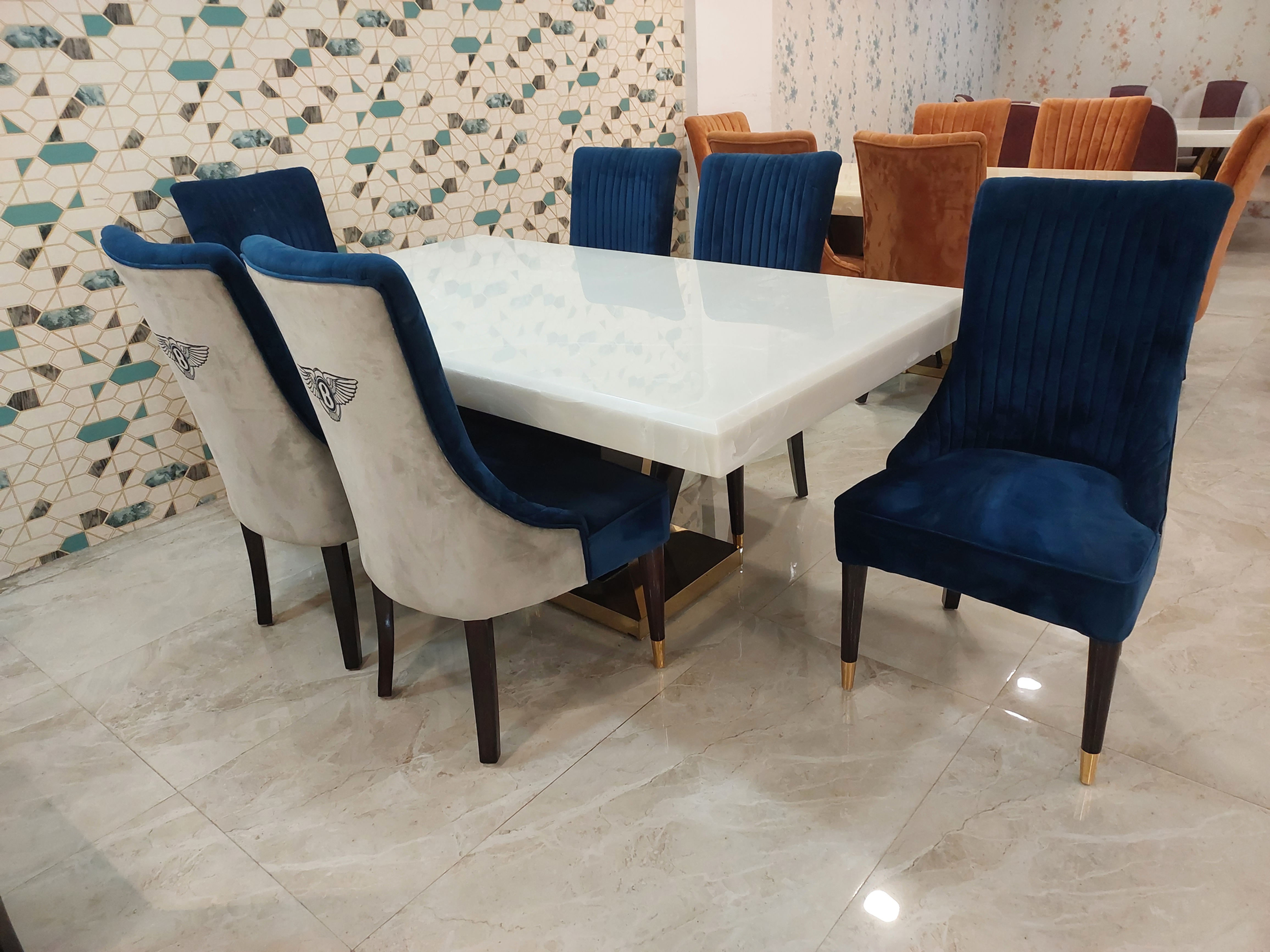 6x3.5 feet dining table featuring white onyx top with a sleek center base