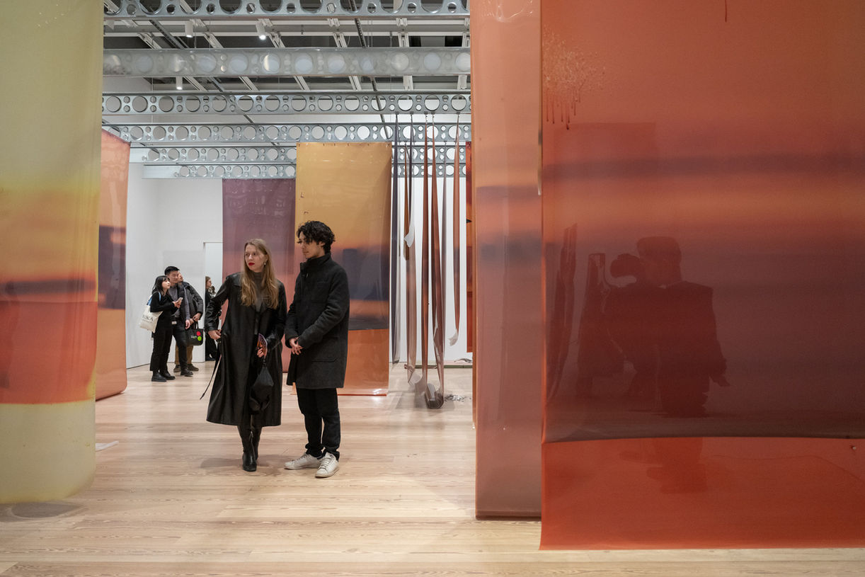 photo of a gallery with artwork on view