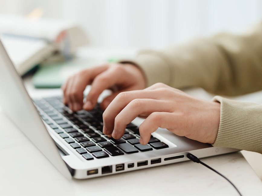 close up shot of a person using a laptop