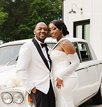 Wedding photography bride and groom posing next to a car
