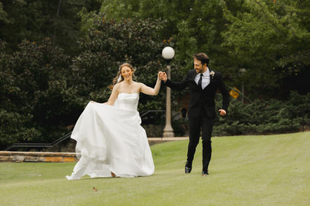 Wedding photography, bride and groom walking in park at Vulcan park and Museum in Birmingham, Alabama