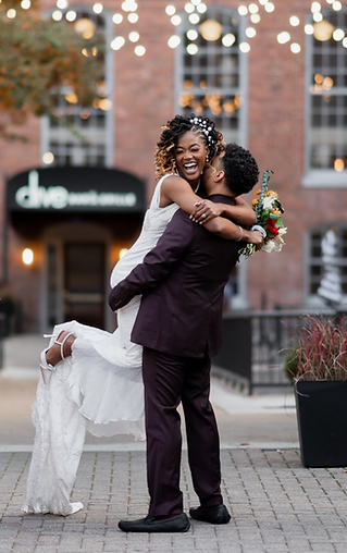 Wedding photography Bride and groom selebrating at The Great Room at Savage Mill in Baltimore, MD