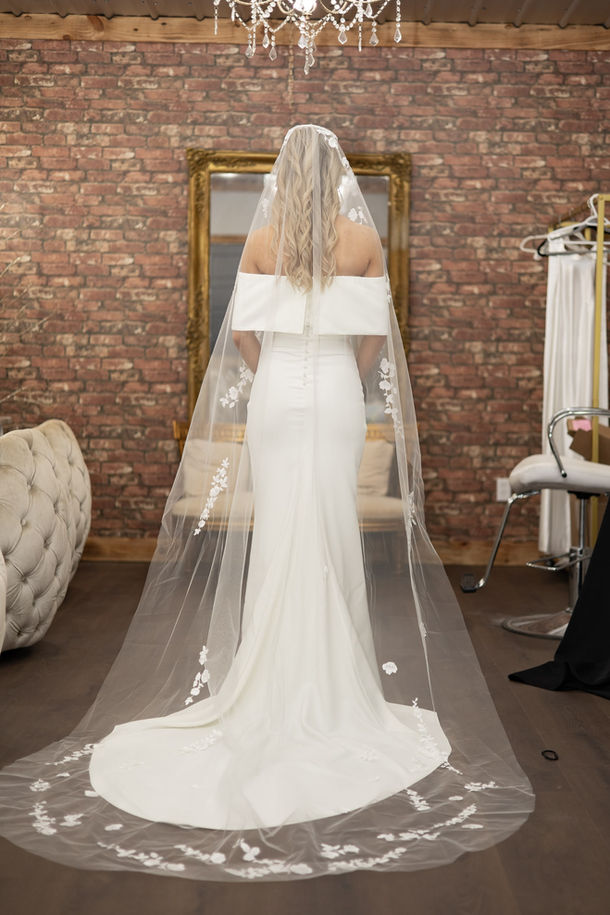 bride getting ready in white barn at Padgett place.
