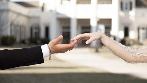 Bride and groom holding hands at Botanical Garden in Huntsville, Alabama