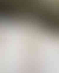 Elegant wedding reception table decor with candles, greenery, and place settings