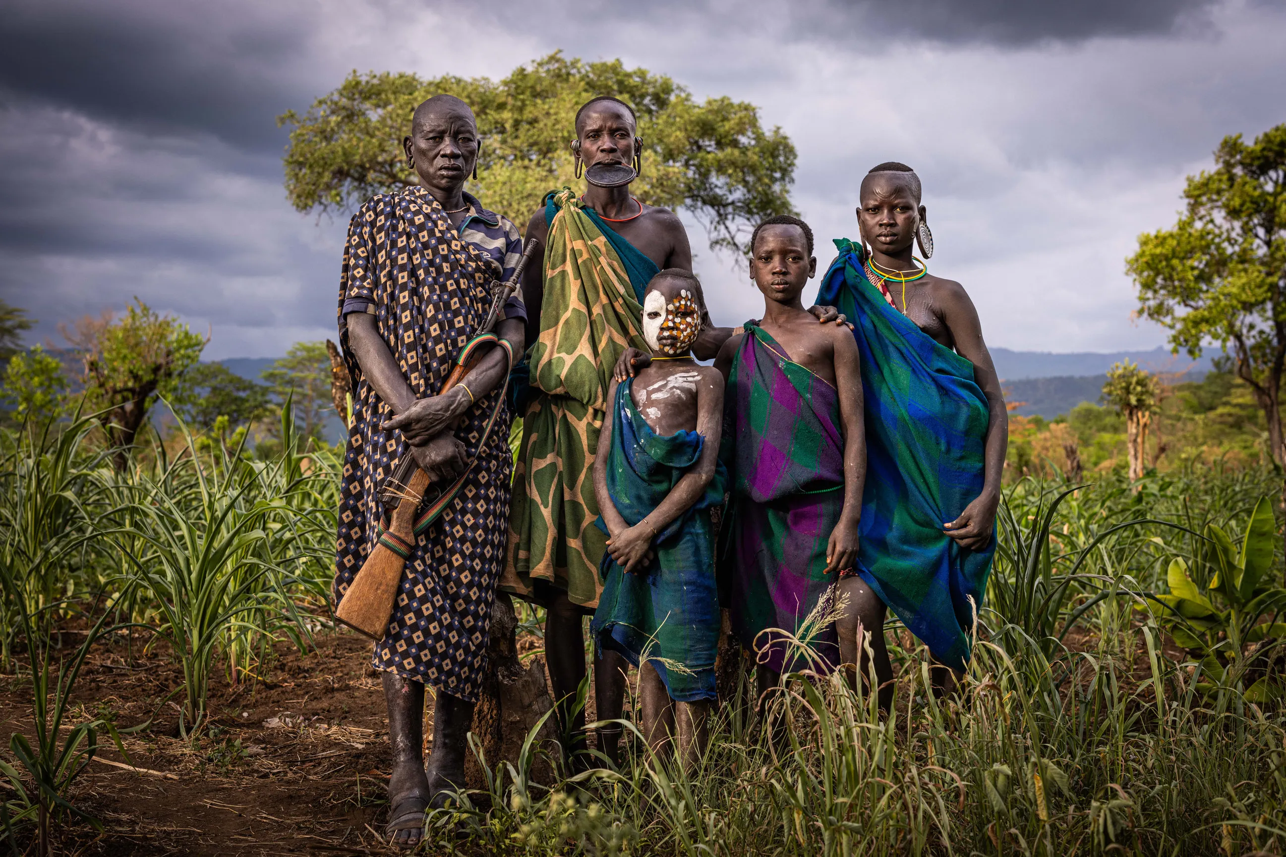 A Suri family in Omo valley Landscape