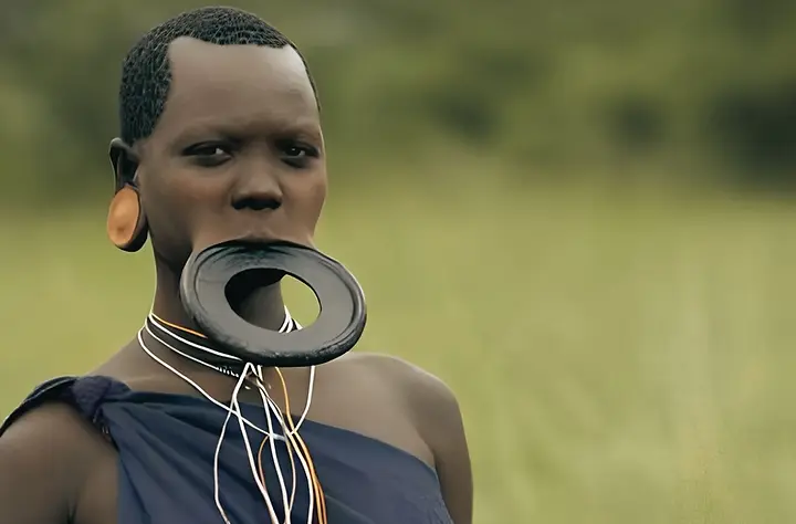 Learn why Suri women wear lip plates, what the practice means, and why common claims about slave raids and bridewealth need caution.