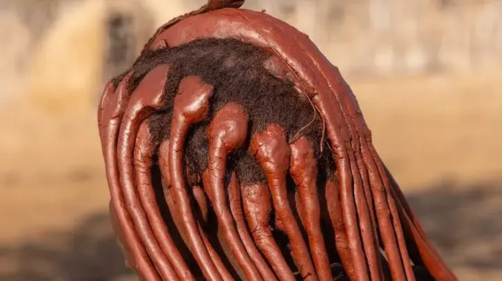 Learn why Himba women use red ochre, known as otjize, for beauty, identity, body care, and protection in northern Namibia.