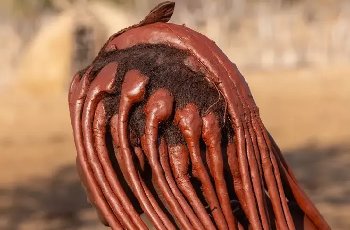 Learn why Himba women use red ochre, known as otjize, for beauty, identity, body care, and protection in northern Namibia.