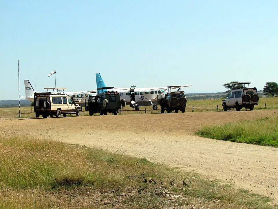 Light aircraft and safari vehicles at Seronera Airstrip