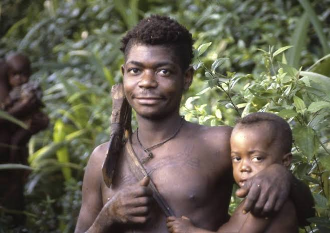 The photograph offers a glimpse of family life in a forest environment