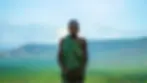 A Surma woman stands overlooking Ethiopia's Lower Omo Valley, homeland of Surmic-speaking communities including the Suri and Mursi peoples
