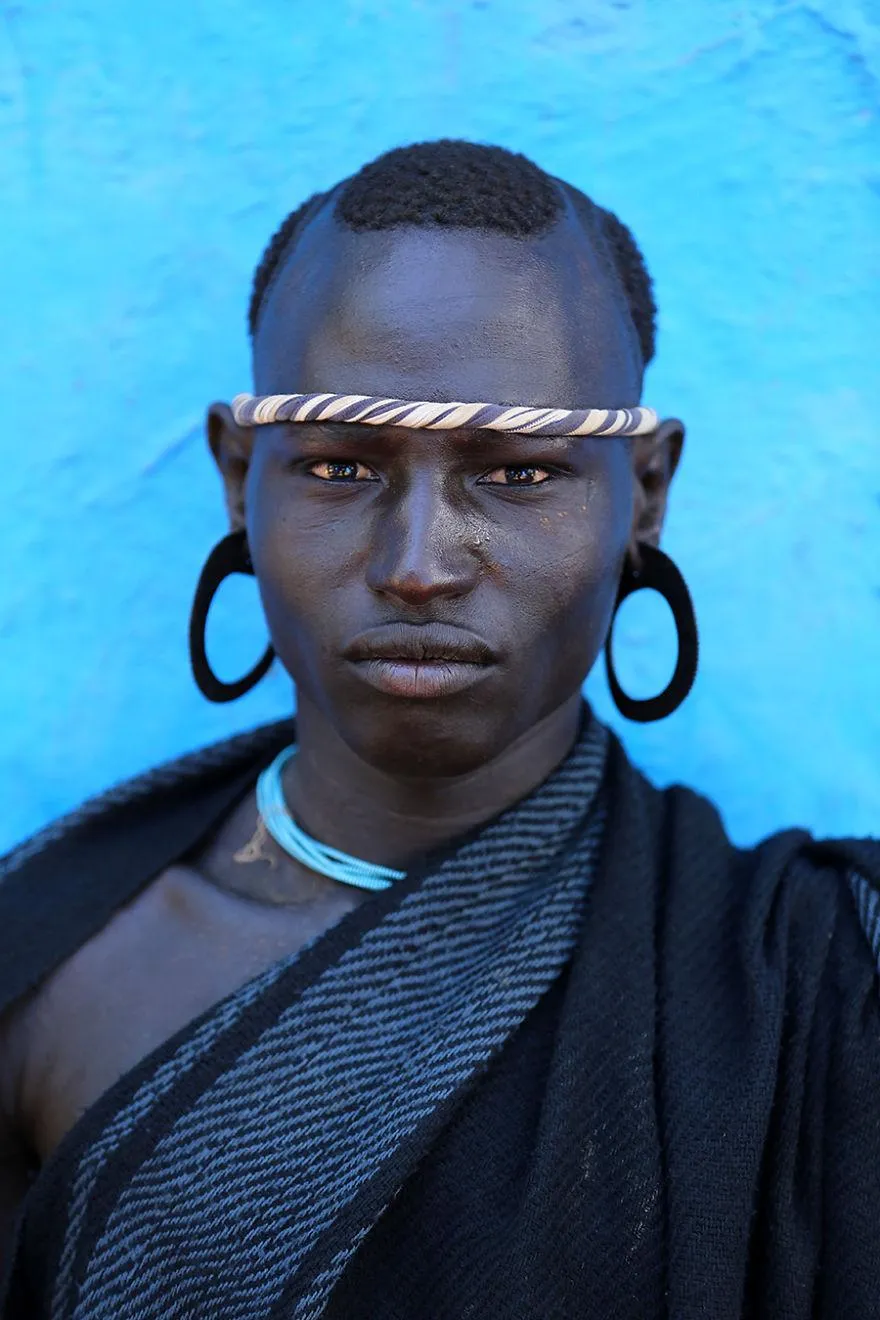 Bodi (Me'en) man with traditional ear ornaments and headband.