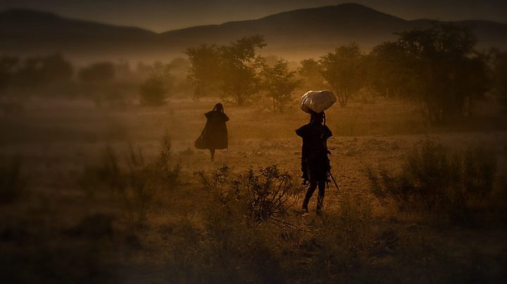 how Himba religion connects ancestors, the holy fire, sacred cattle, family, and modern change in northern Namibia