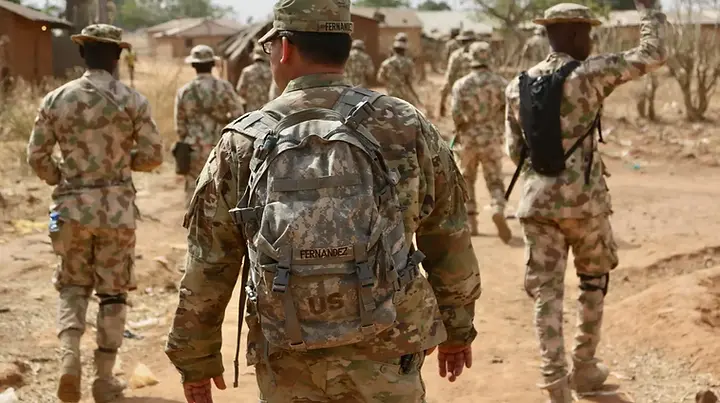 Nigeria says about 100 US troops have arrived to train and advise local forces as Abuja seeks more support to tackle insurgents.