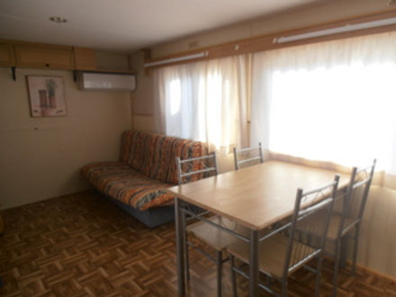 dining and living area one bedroom mobil