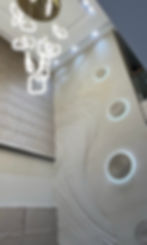 Close-up view of carved stone panels for a double height wall