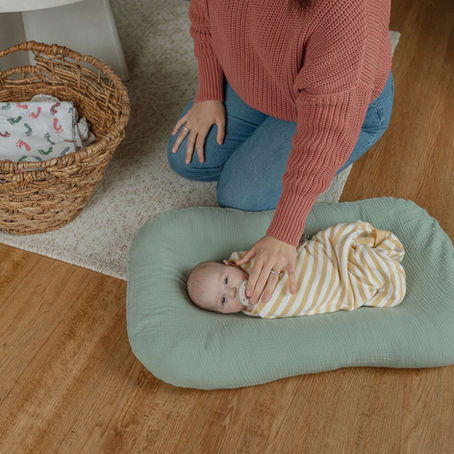 A sleep consultant soothing a baby