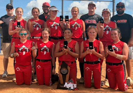 The Indiana Aces travel softball team won the 12-and-under B Great Lakes National Tournament in Columbus, Ind., from July 6-10. The team went 6-1-1 over eight games to top a field of 22 teams. Front, from left – Elizabeth Grandstaff, Caroline Cotner, Aubriella Garcia, Skylar Hudson, Teagan Long. Middle – Harper Johnson, Delta Mayhill, Lillie Ridenour, Bray Byer, Mae Gilford. Back – assistant coach Tim Gilford, coach Kyle Mayhill, assistant coach Troy Hudson, assistant coach Kyle Grandstaff. Elizabeth Grandstaff will be a seventh-grader at Pioneer this fall, Cotner will be a seventh-grader at Winamac, and Long and Johnson will be eighth-graders at Caston. (photo provided)