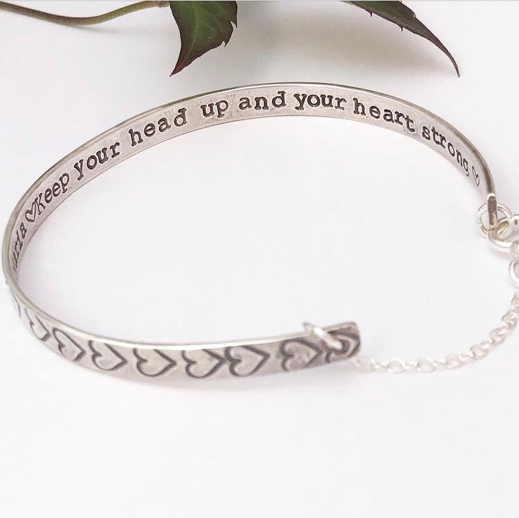 Thumbnail: Close-up of personalised heart engraving on sterling silver cuff