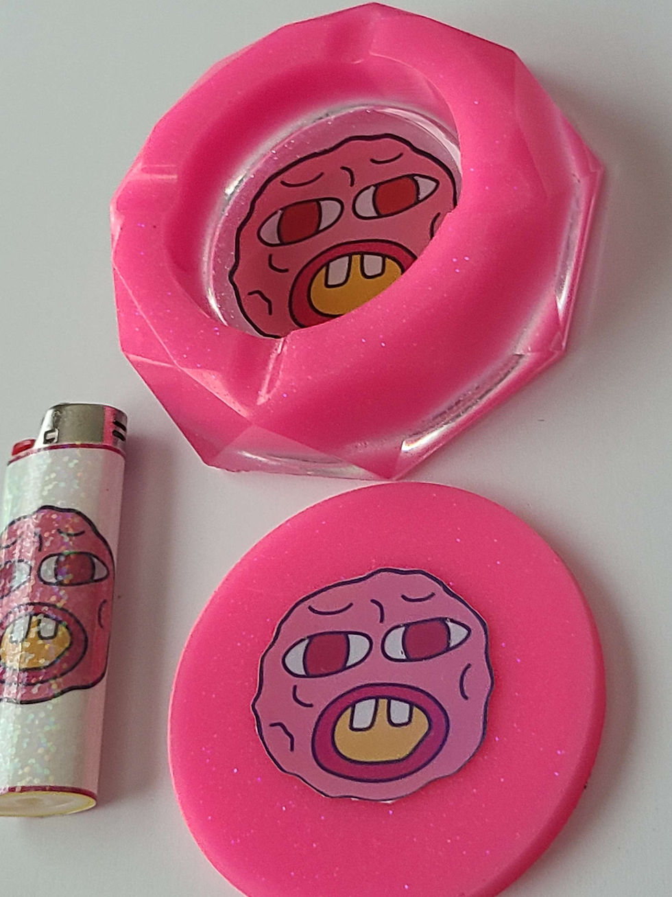 Thumbnail: Showcase your love for Tyler-the-Creator with this pink, "Cherry Bomb" ashtray set.