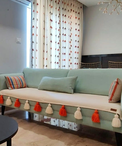 Neutral_Tassel_Sofacover_OrangeWhite_tassels (3)_edited.jpg