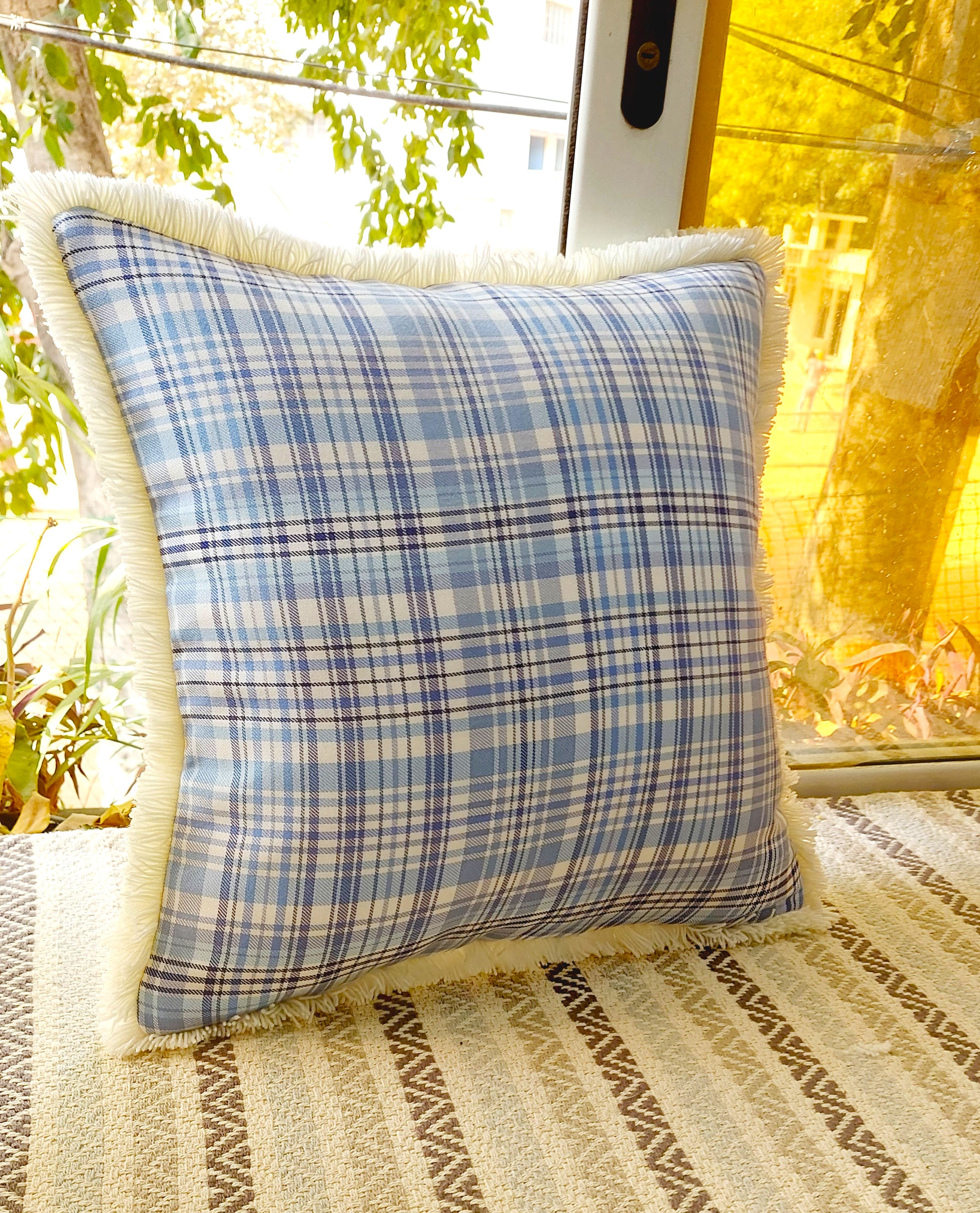 "Complement Your Interior Design with the Versatile Blue Plaid with White Frill Cushion Cover"