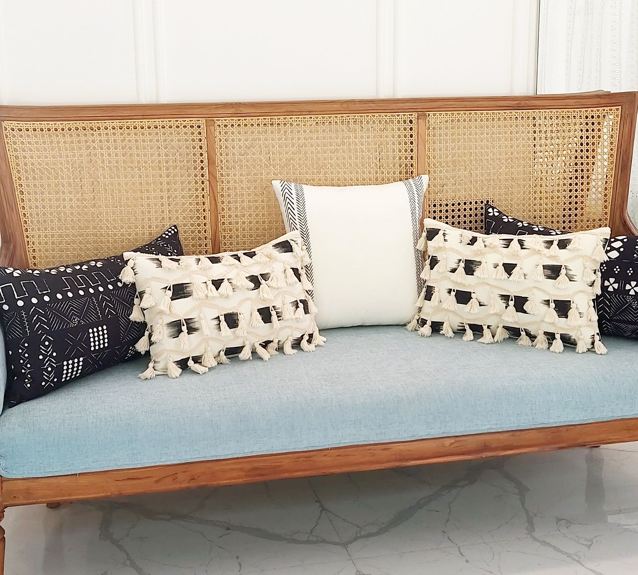 "Zipper closure for practicality, cotton material for comfort in this black cushion cover."