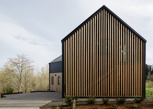 side of house with wood slates in the country