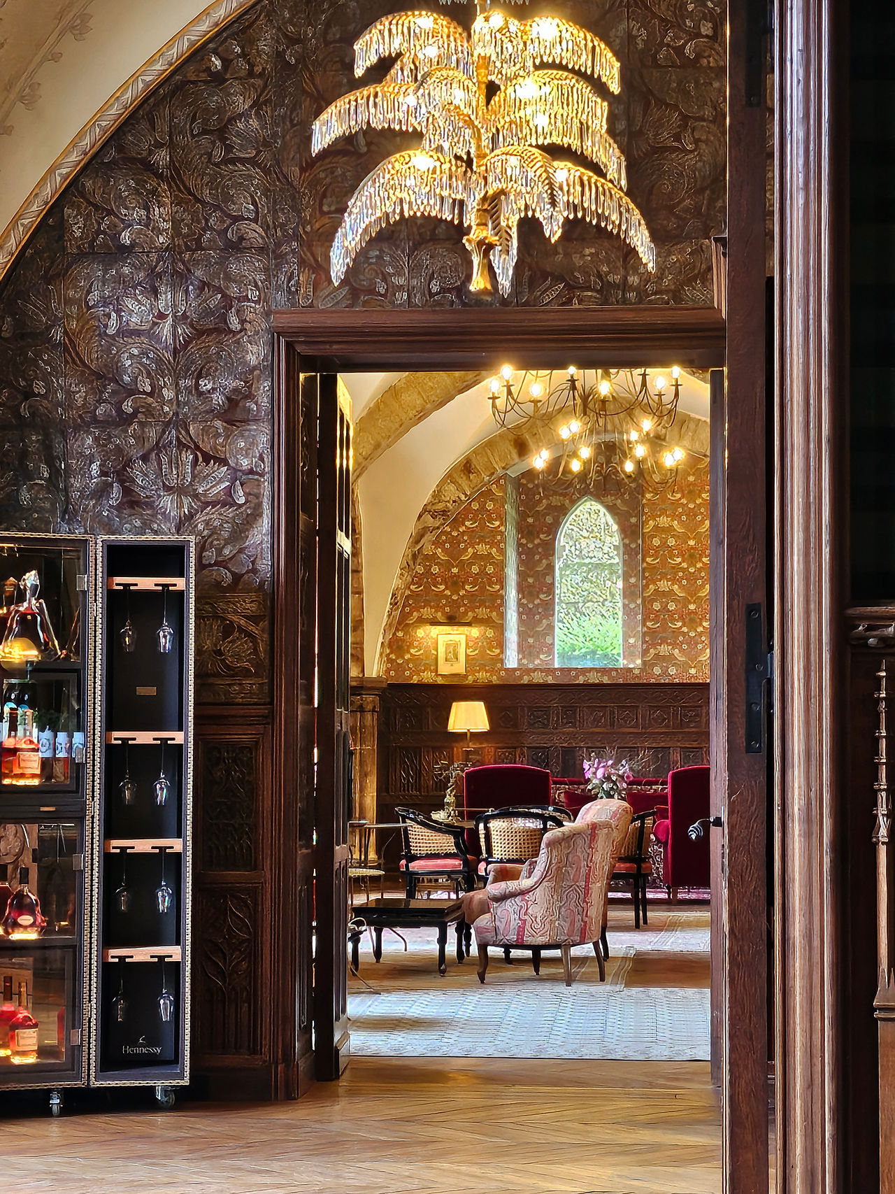 bar and salon at luxury French hotel in maximalist style