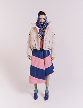 a bold leather dress is accented with a jacket, hoodie, patterned scarf, and shoes