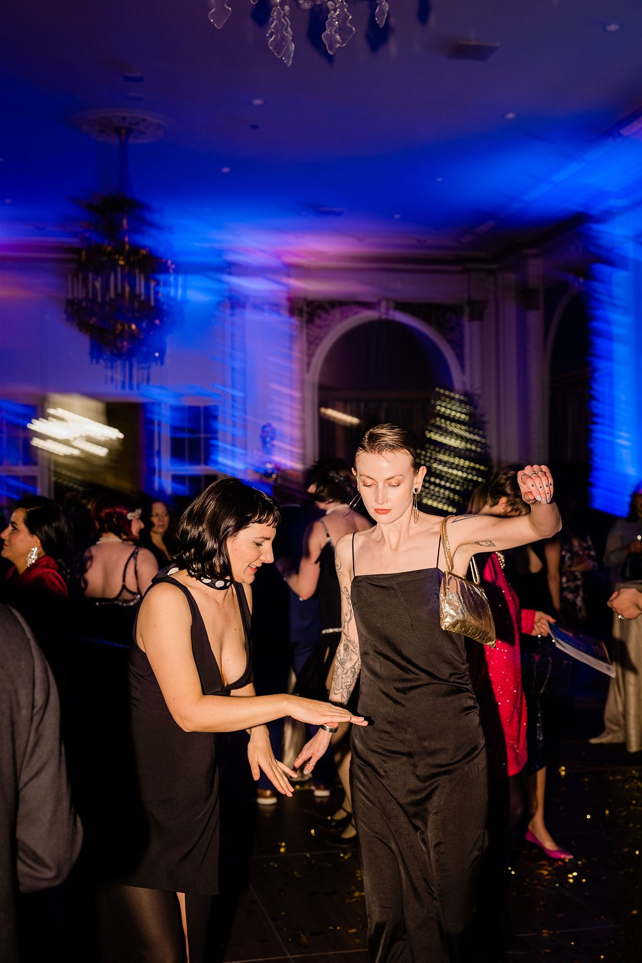 party guests dancing at formal gala in ballroom
