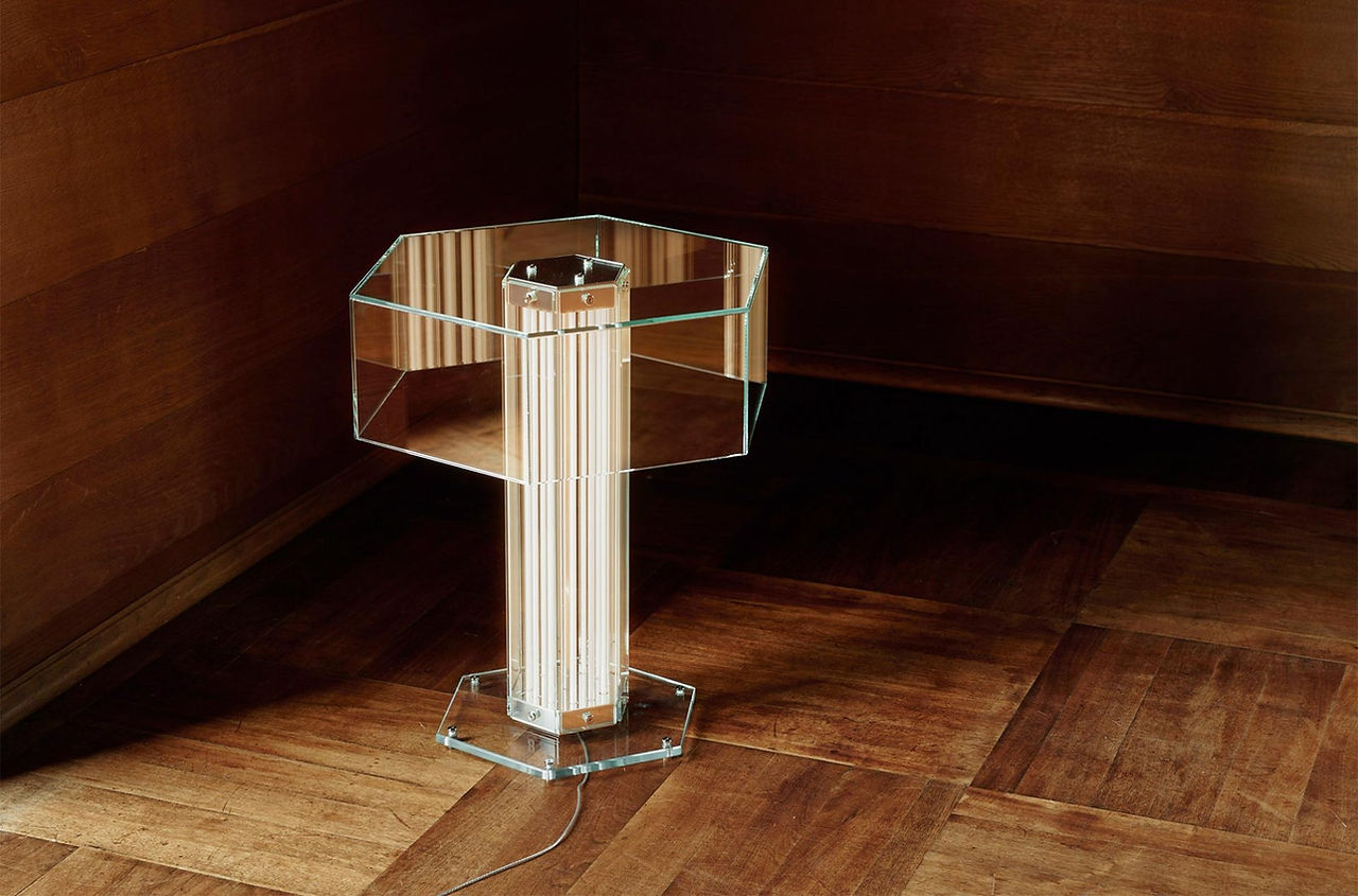 Flos table lamp designed by Formafantasma in glass panels and LED light